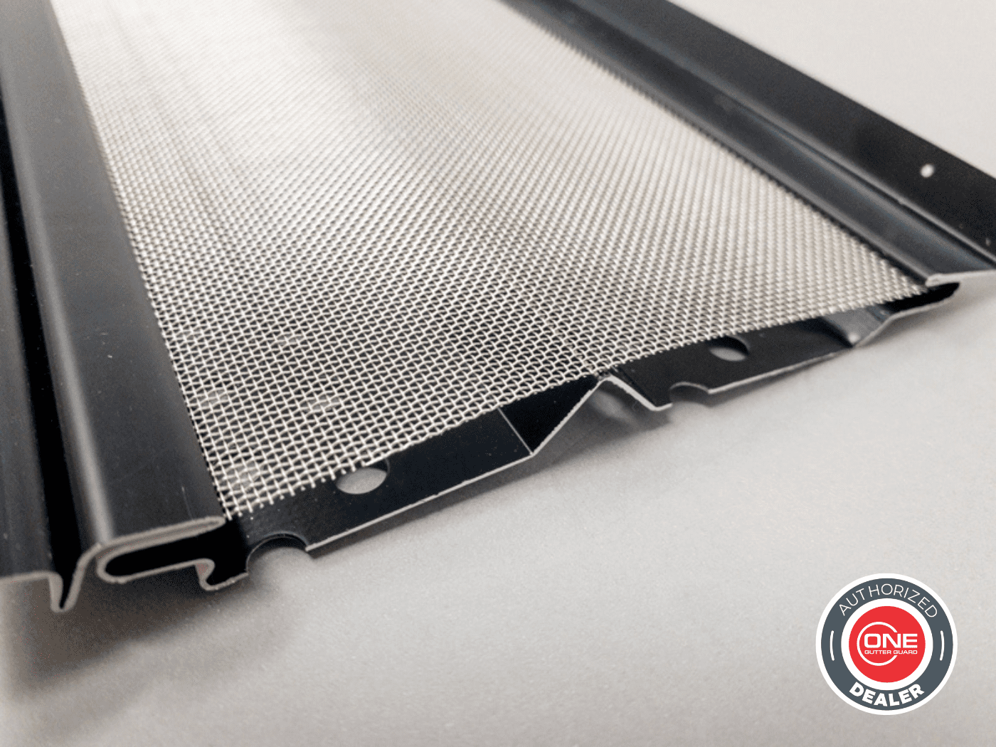 Close-up of a stainless steel mesh gutter guard panel designed for debris protection and water flow, representing the high-quality ONE Gutter Guard™ product offered by Modern Gutter Solutions, an authorized dealer and professional installer.